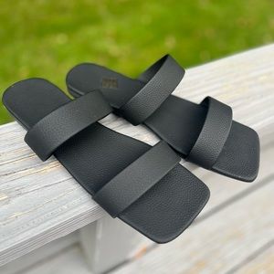 Black flat sandals with squared off toe